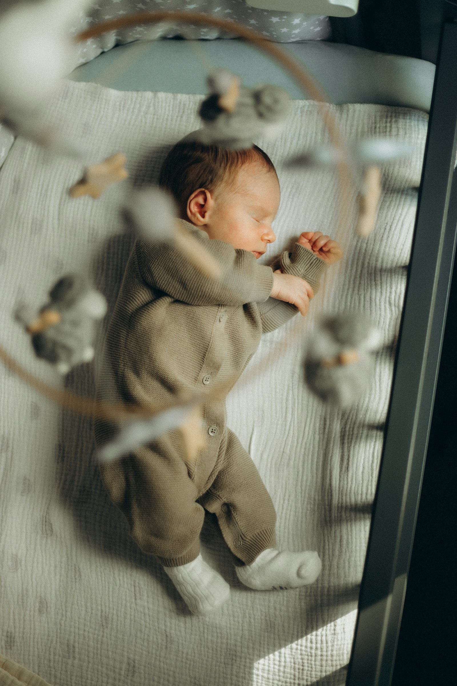 Newborn baby sleeping peacefully in a crib